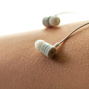 Music lover is having goosebumps, enjoying and feeling pleasure from favorite relaxing song. Musical addiction. Music concept